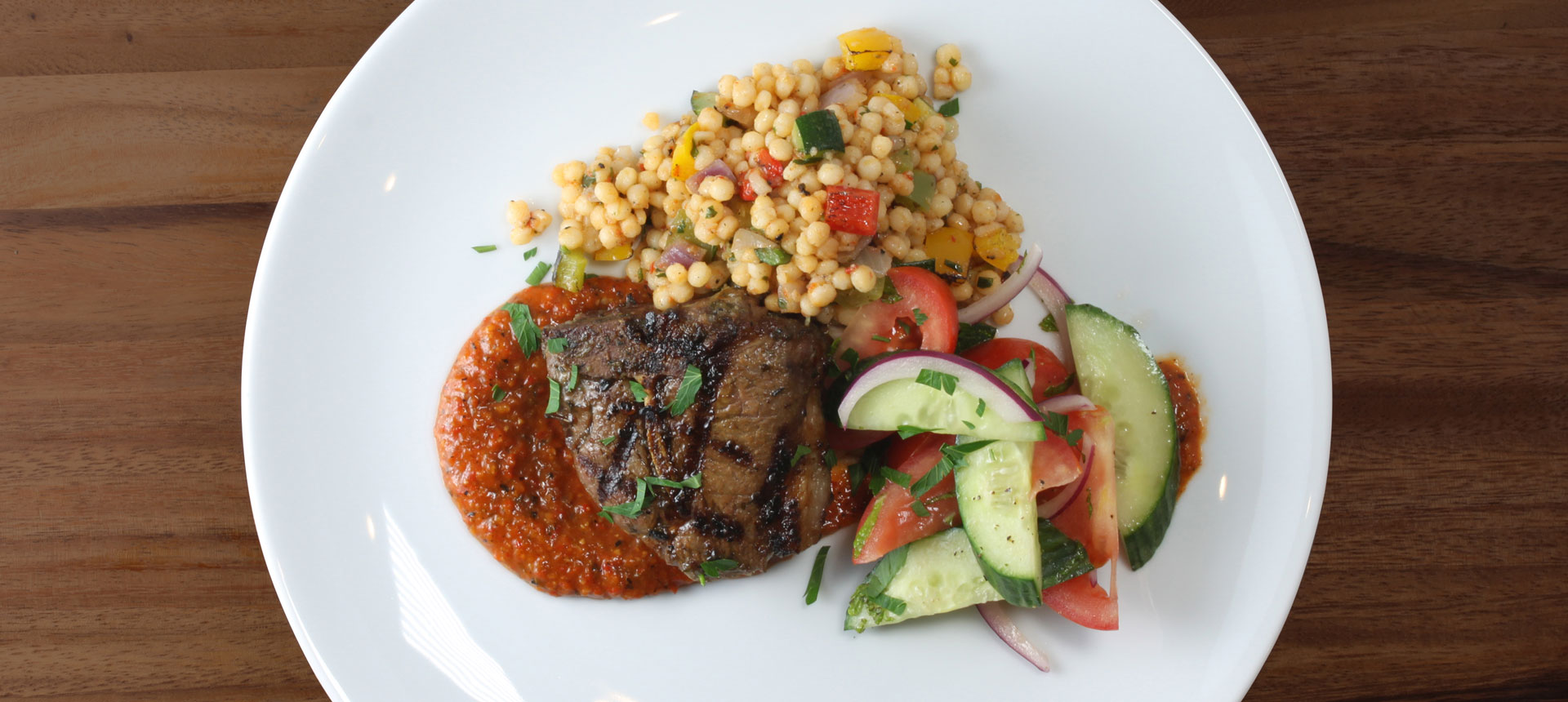 Lamb Chop with Ancient Grain Blend Ancient Grain Blend, Chimichurri Sauce, Harissa Sauce and Lemon Mint Vinaigrette